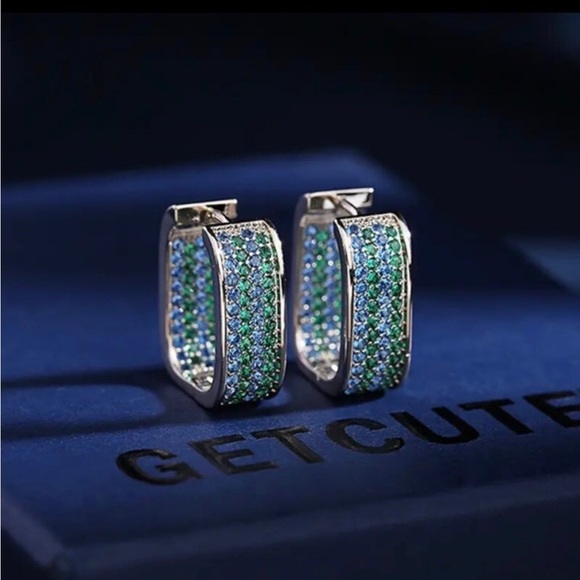 Swarovski Jewelry - Rhodium plated hoop earrings with swarovski elements